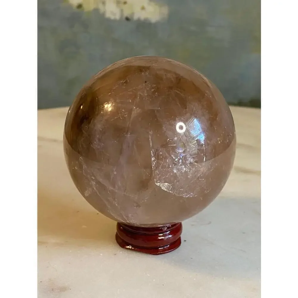 Large hematoid fire quartz sphere